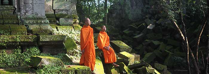 monks in the green forest at Koh Ker temple