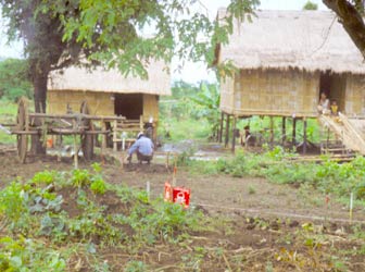 Cambodian man working next to a mined field