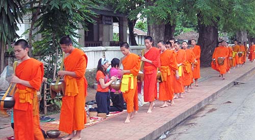 Monks collecting their daily alms